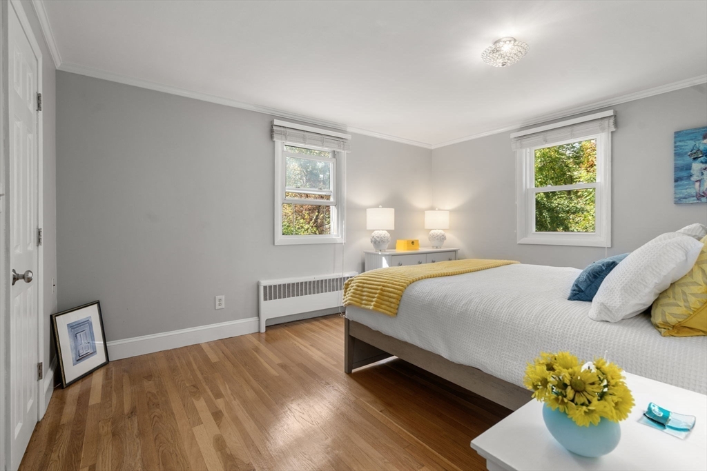 5 Oakwood Road Acton, MA 01720 - Photo 8 of 17 a bedroom with a bed and a window