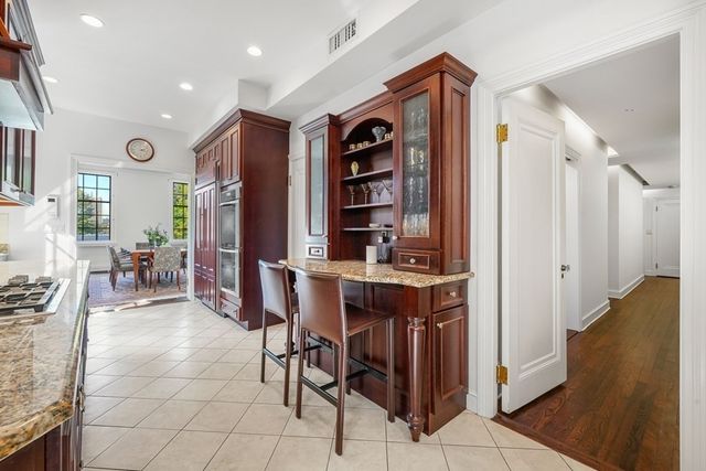 a bedroom with furniture and a flat screen tv