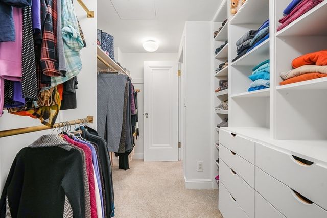 a bedroom with a bed next to a window