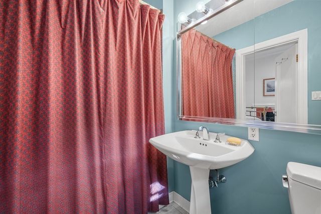 a bedroom with a bed and a table