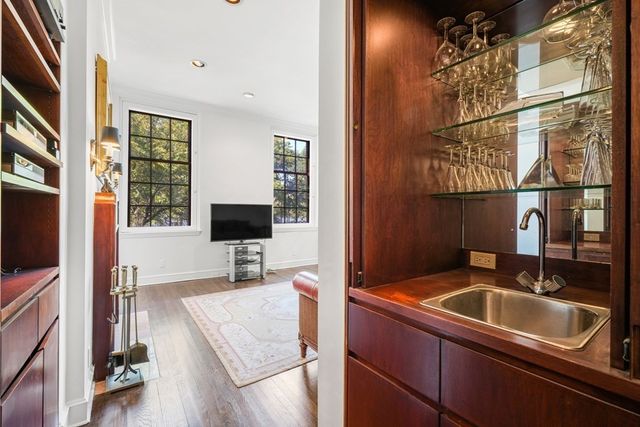 a bathroom with a toilet a sink and a mirror