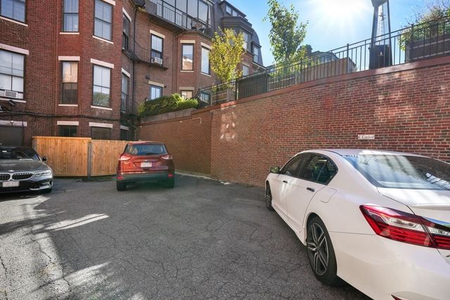 a view of pathway in front of house with a yard