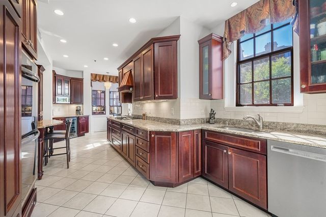 a kitchen with a sink counter top space and cabinets