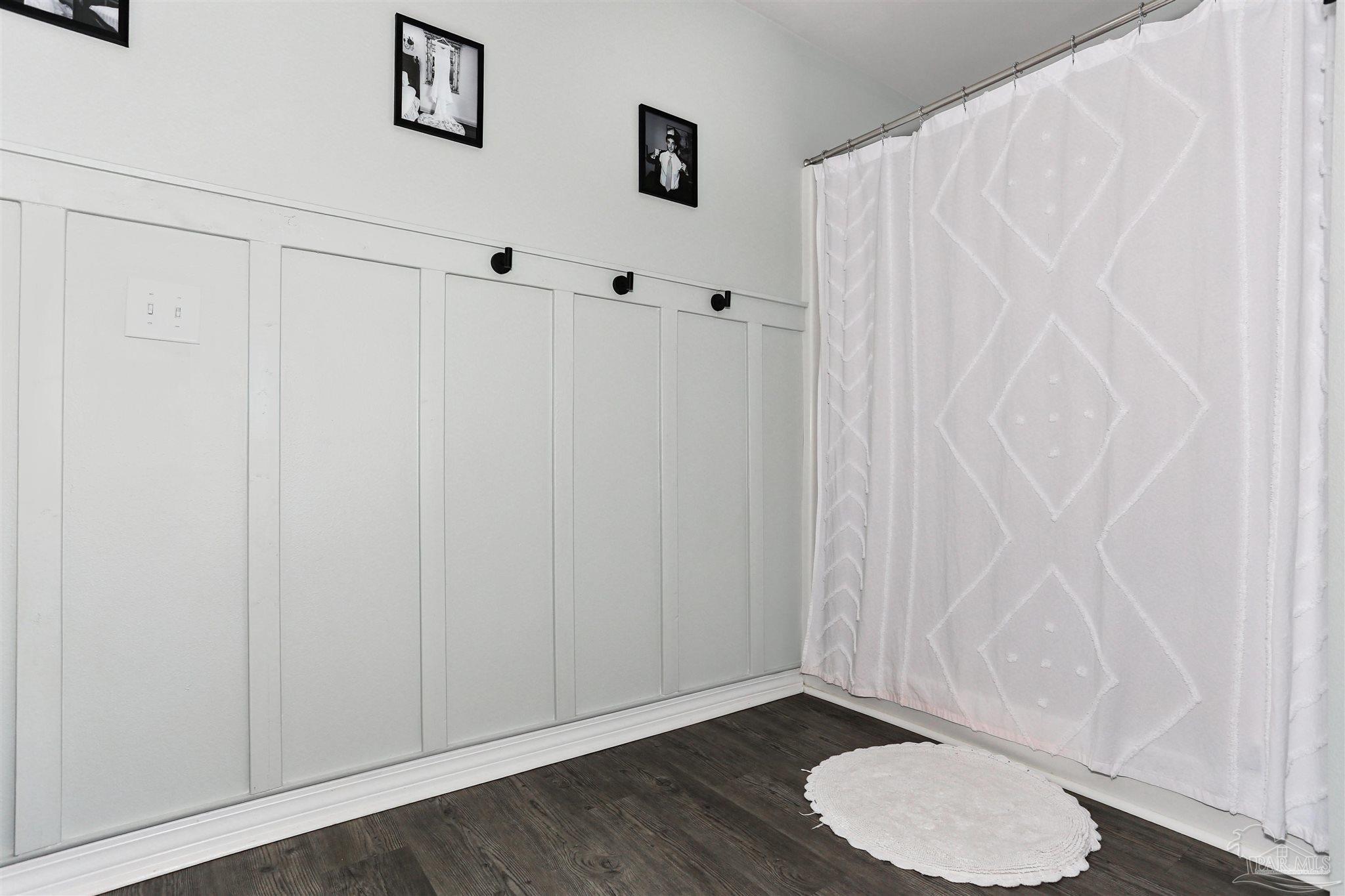 3545 Godwin Road Jay, FL 32565 - Photo 14 of 24 a bathroom with a toilet and a shower curtain