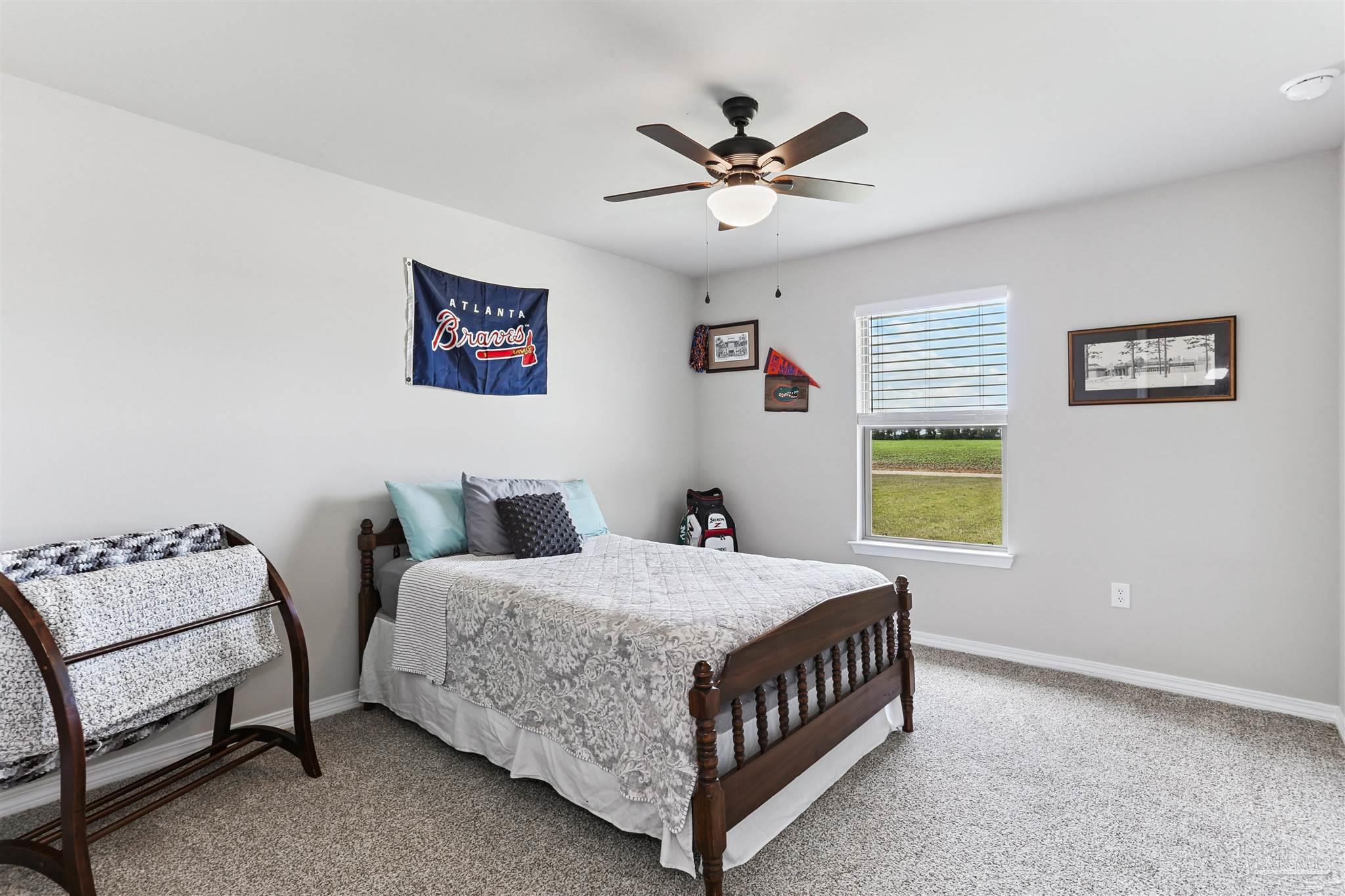 3545 Godwin Road Jay, FL 32565 - Photo 16 of 24 a bedroom with a bed window and couch