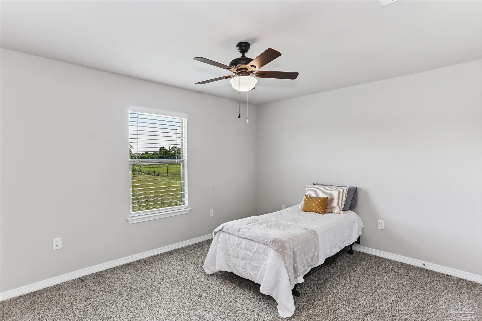 3545 Godwin Road Jay, FL 32565 - Photo 18 of 24 a bedroom with a bed and a window