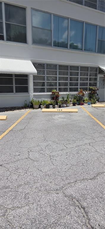 911 Washington Avenue Southwest, Unit 304 Largo, FL 33770 - Photo 25 of 26 a front view of a house with garage