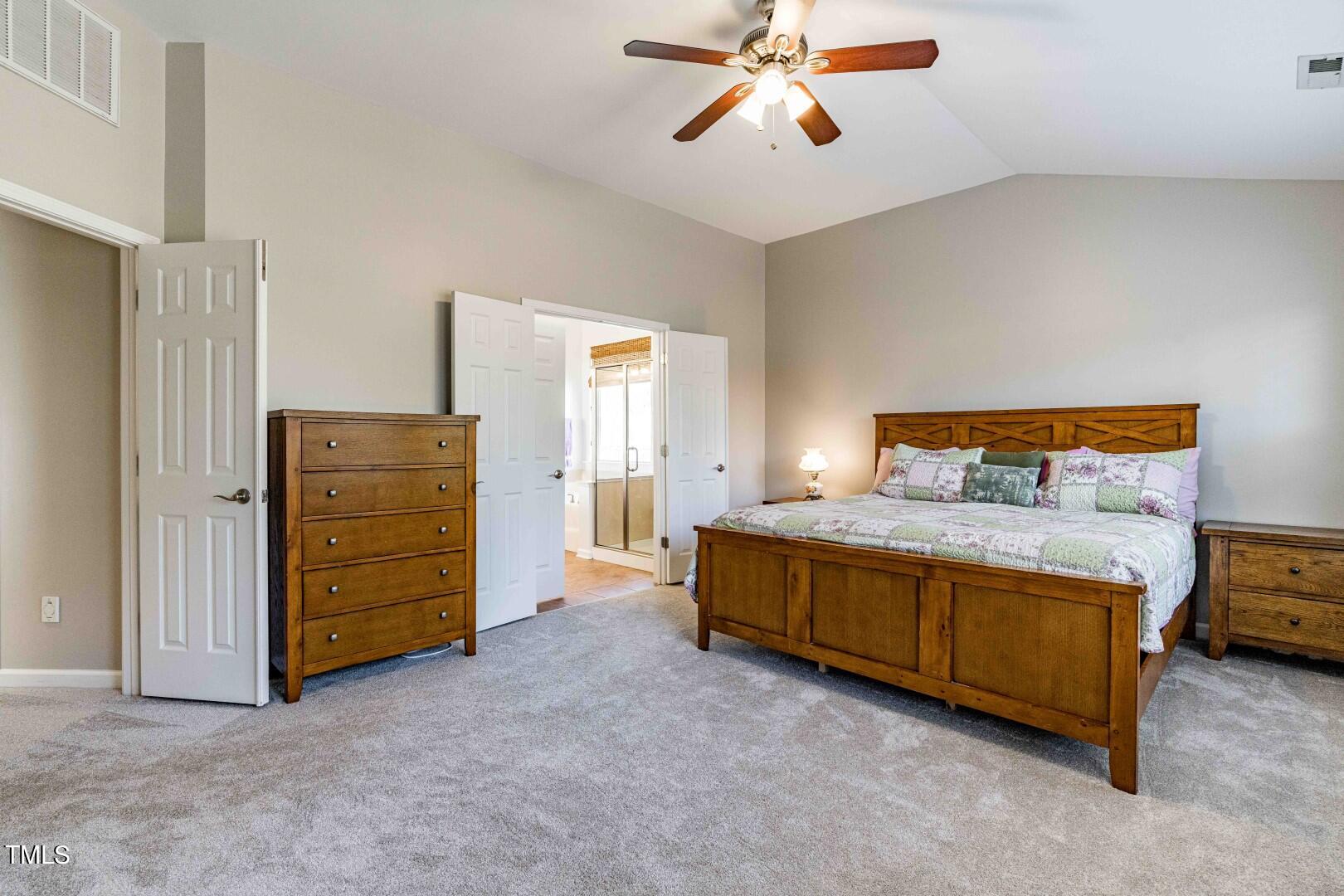 1017 Lakeview Road Durham, NC 27712 - Photo 15 of 32 a bedroom with a bed and a cabinets
