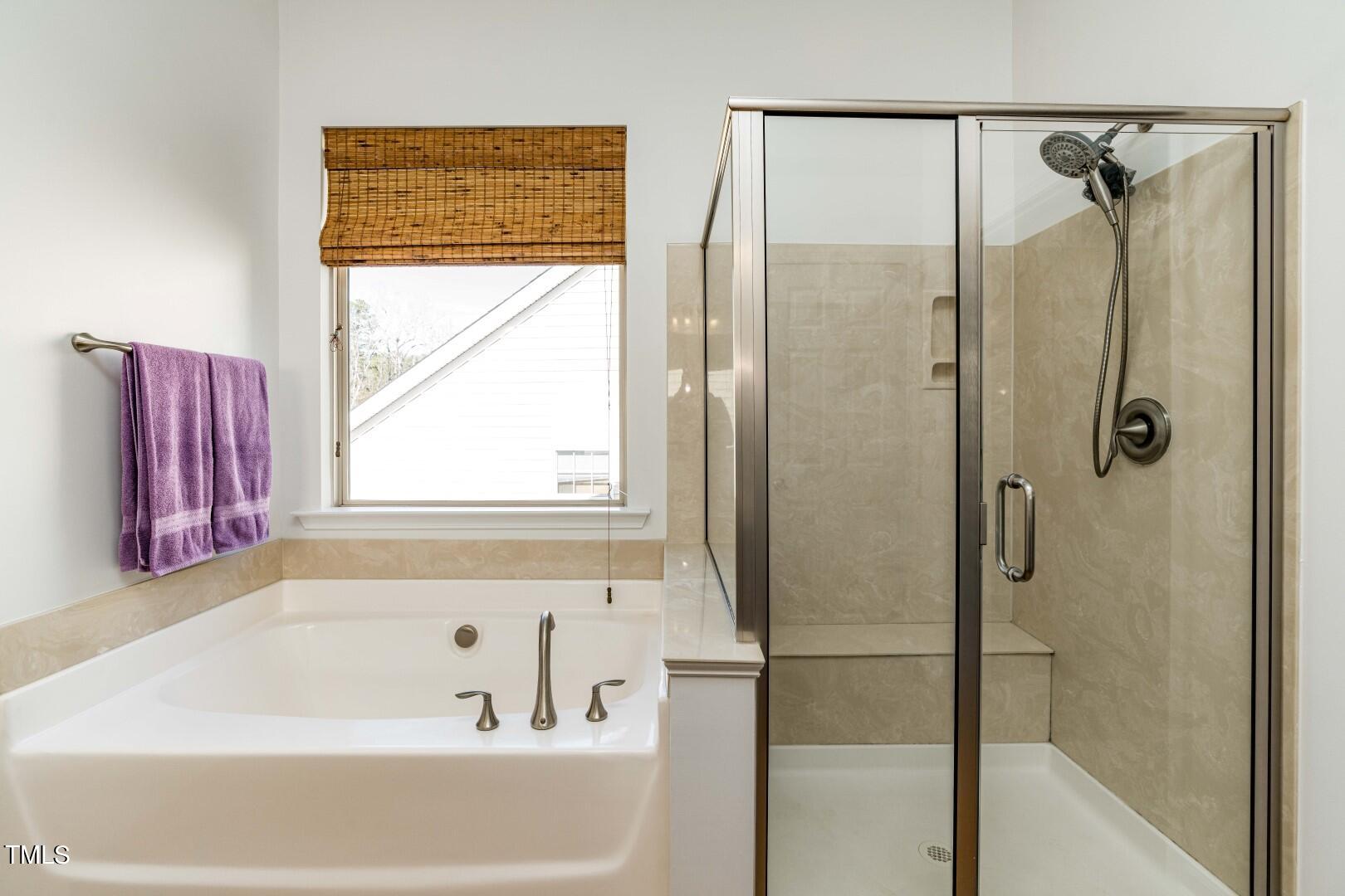 1017 Lakeview Road Durham, NC 27712 - Photo 19 of 32 a bathroom with a bathtub and a shower