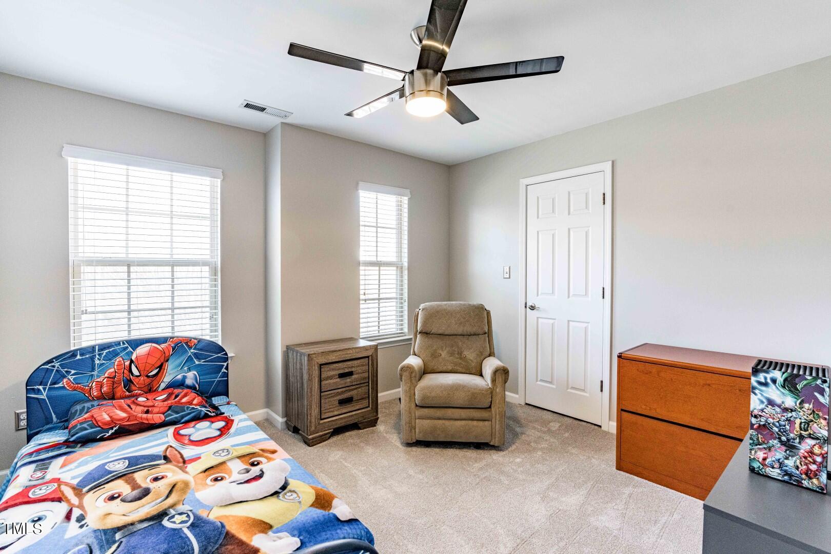 1017 Lakeview Road Durham, NC 27712 - Photo 22 of 32 a bedroom with furniture and a window