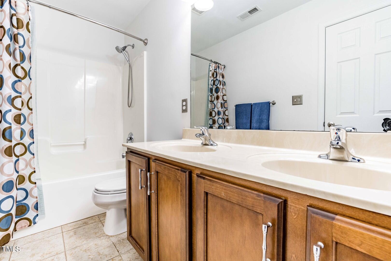 1017 Lakeview Road Durham, NC 27712 - Photo 24 of 32 a bathroom with a sink toilet and shower