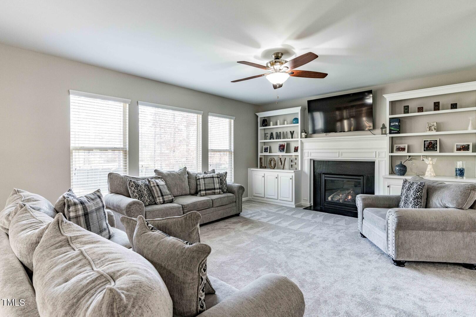 1017 Lakeview Road Durham, NC 27712 - Photo 4 of 32 a living room with furniture and a fireplace