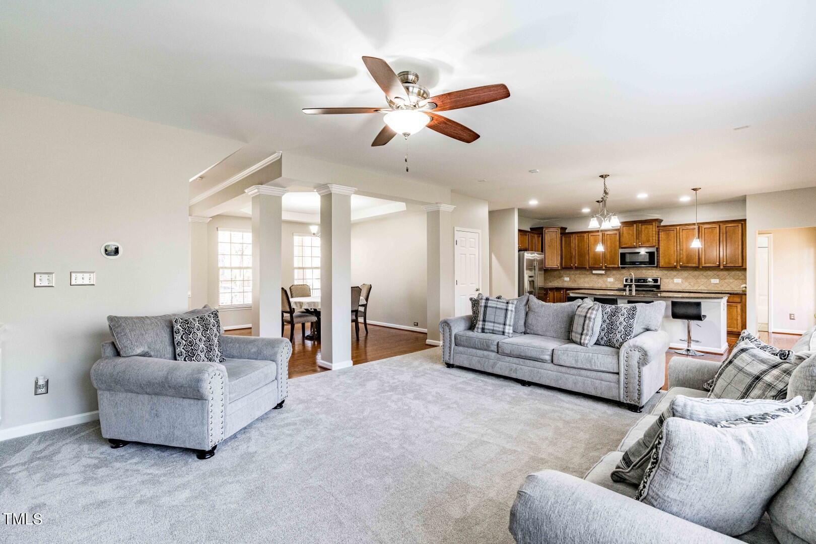 1017 Lakeview Road Durham, NC 27712 - Photo 5 of 32 a living room with furniture kitchen view and a chandelier