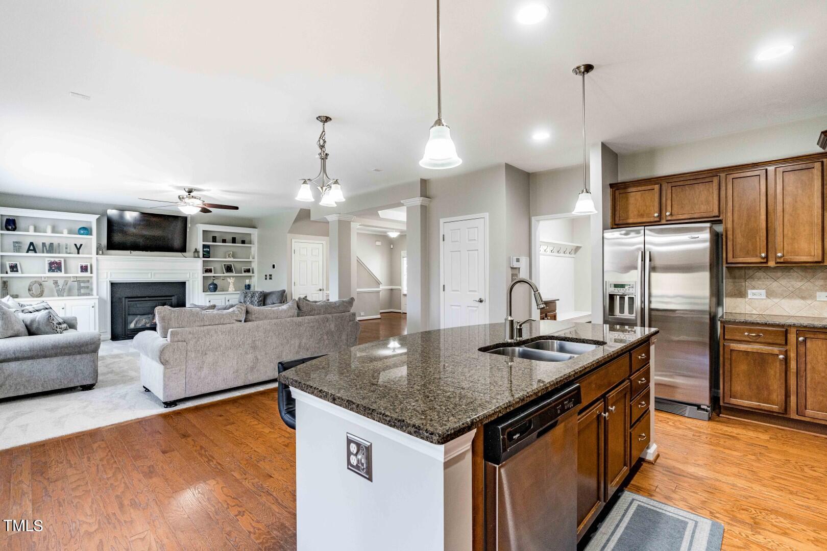 1017 Lakeview Road Durham, NC 27712 - Photo 10 of 32 a kitchen with stainless steel appliances granite countertop a sink a stove and a refrigerator