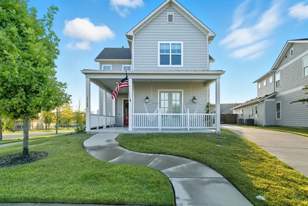 a view of a house with a yard and plants