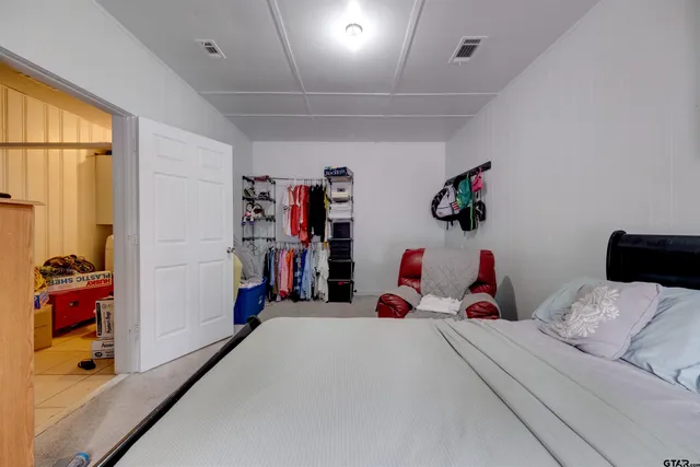 a bedroom with bed and a window