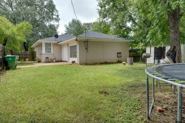a house view with a sitting space and garden