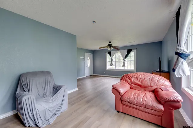 a living room with furniture and a window
