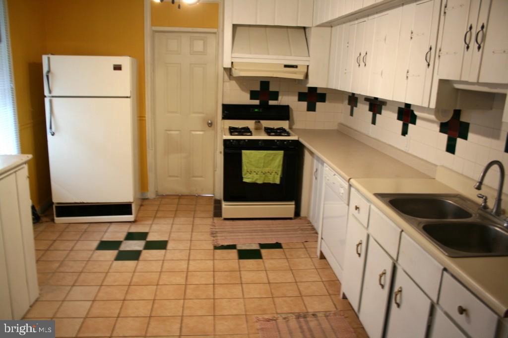 34 East Center Street Lititz, PA 17543 - Photo 4 of 21 a kitchen with a sink a stove and refrigerator