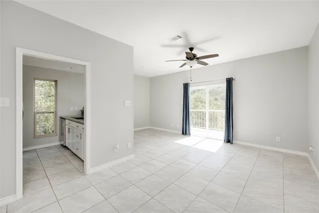 a view of an empty room with a window