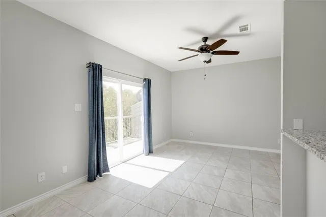 a view of kitchen with stainless steel appliances a refrigerator and a stove top oven