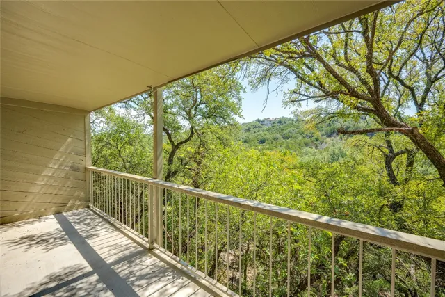 a view of balcony with wooden floor