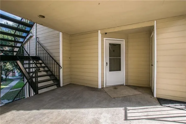 a view of entryway with stairs and wooden floor