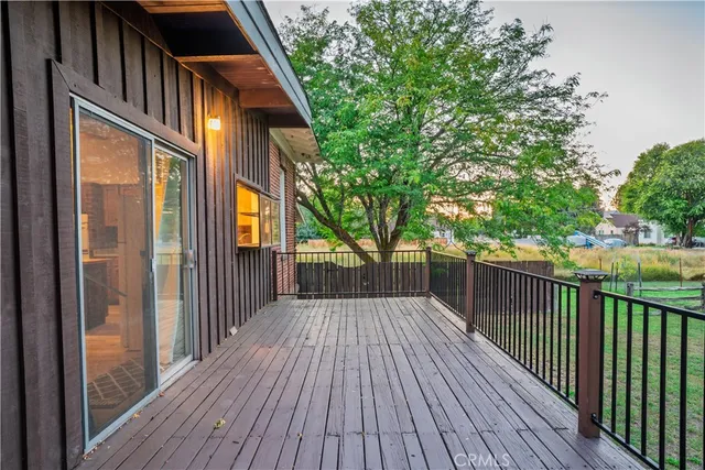 a view of deck with wooden floor and fence