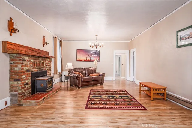 a living room with furniture rug and a fireplace