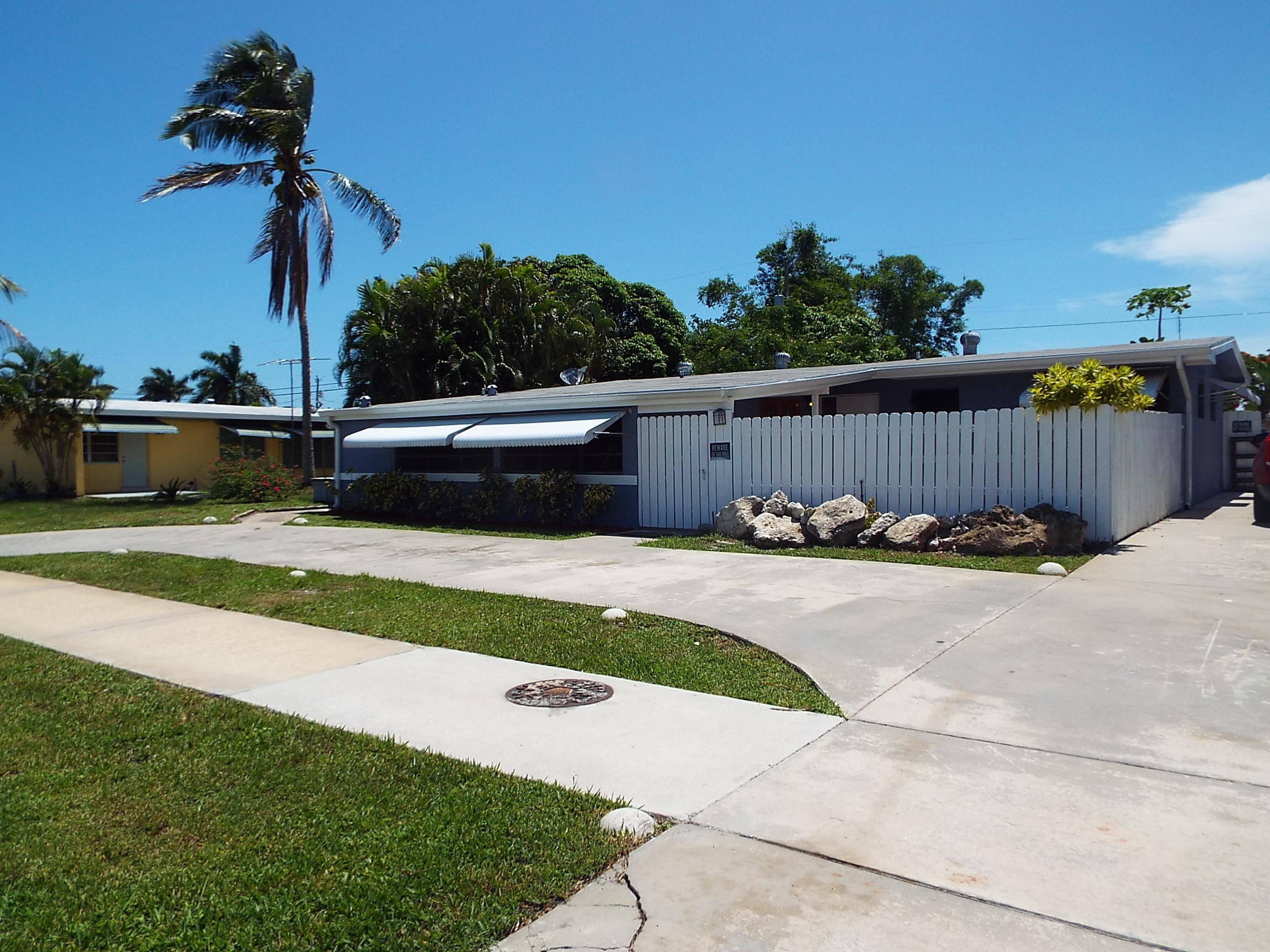 140 Davis Road Palm Springs, FL 33461 - Photo 1 of 19 FRONT