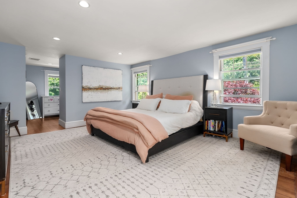 260 Glen Road Weston, MA 02493 - Photo 27 of 42 a spacious bedroom with a bed and a couch