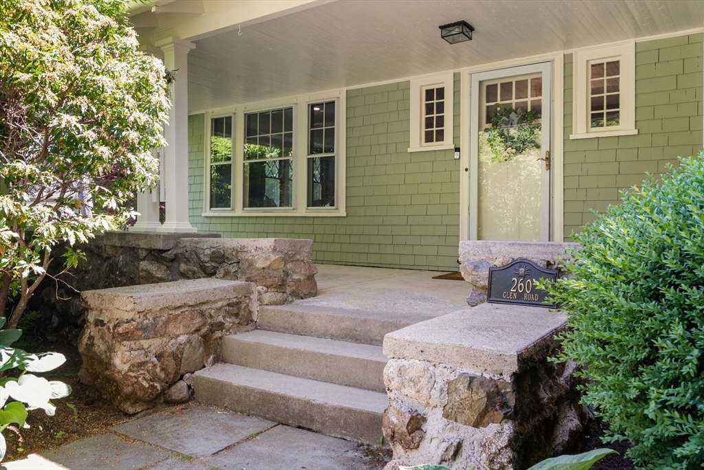 260 Glen Road Weston, MA 02493 - Photo 3 of 42 a front view of a house with outdoor seating