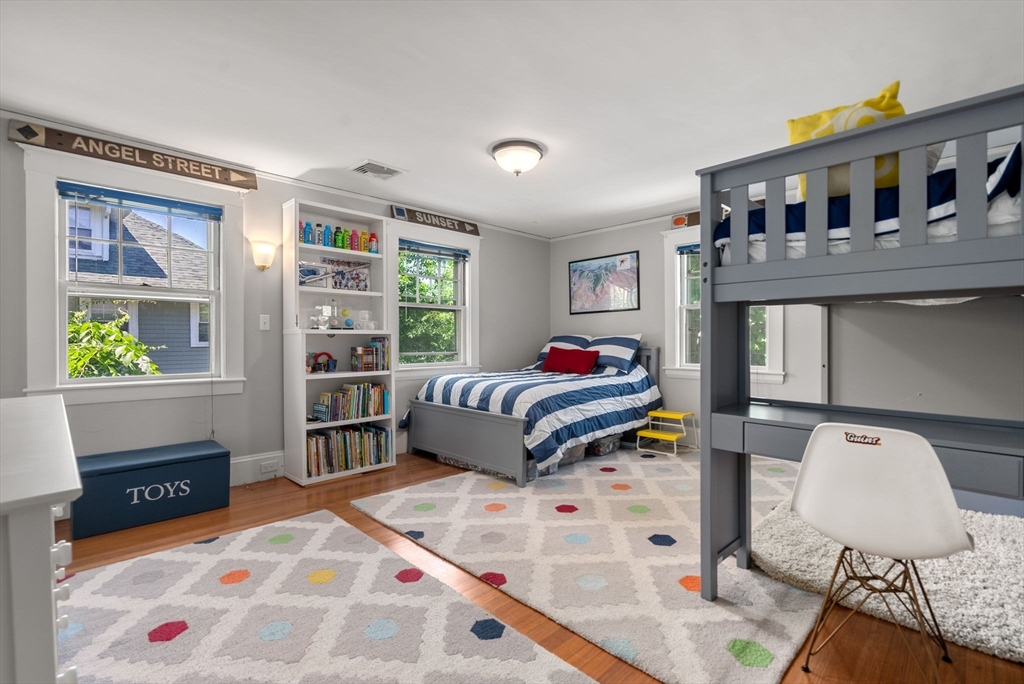 260 Glen Road Weston, MA 02493 - Photo 35 of 42 a bedroom with a bed and wooden floor