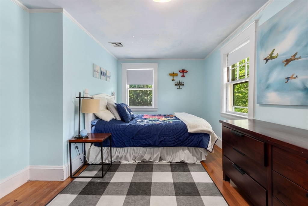 260 Glen Road Weston, MA 02493 - Photo 36 of 42 a bedroom with a bed and wooden floor