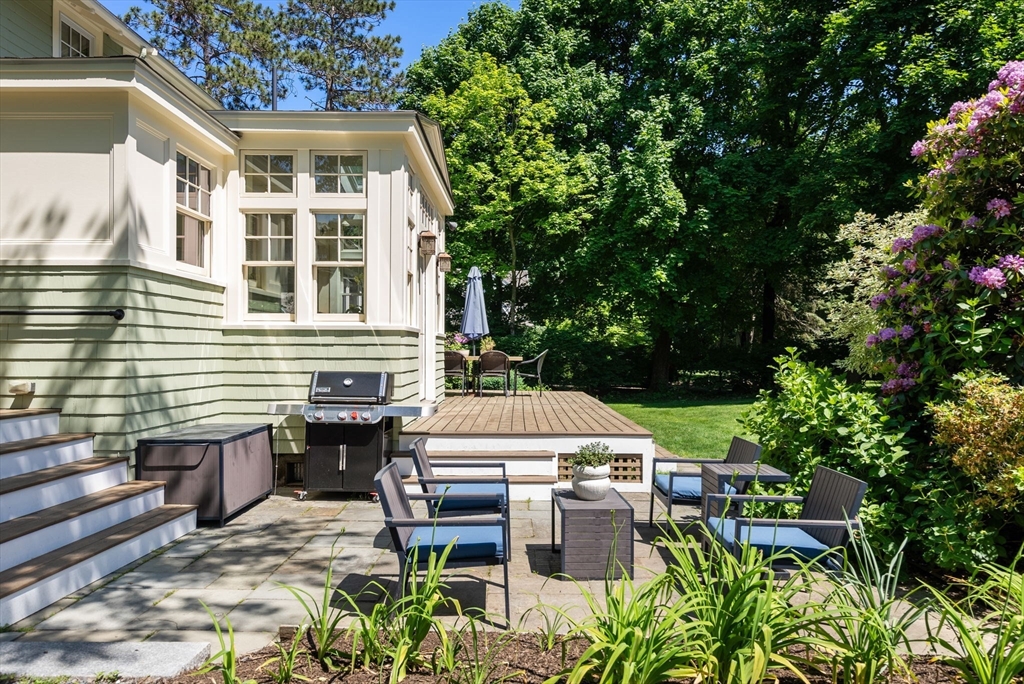 260 Glen Road Weston, MA 02493 - Photo 39 of 42 a view of a patio with table and chairs and potted plants