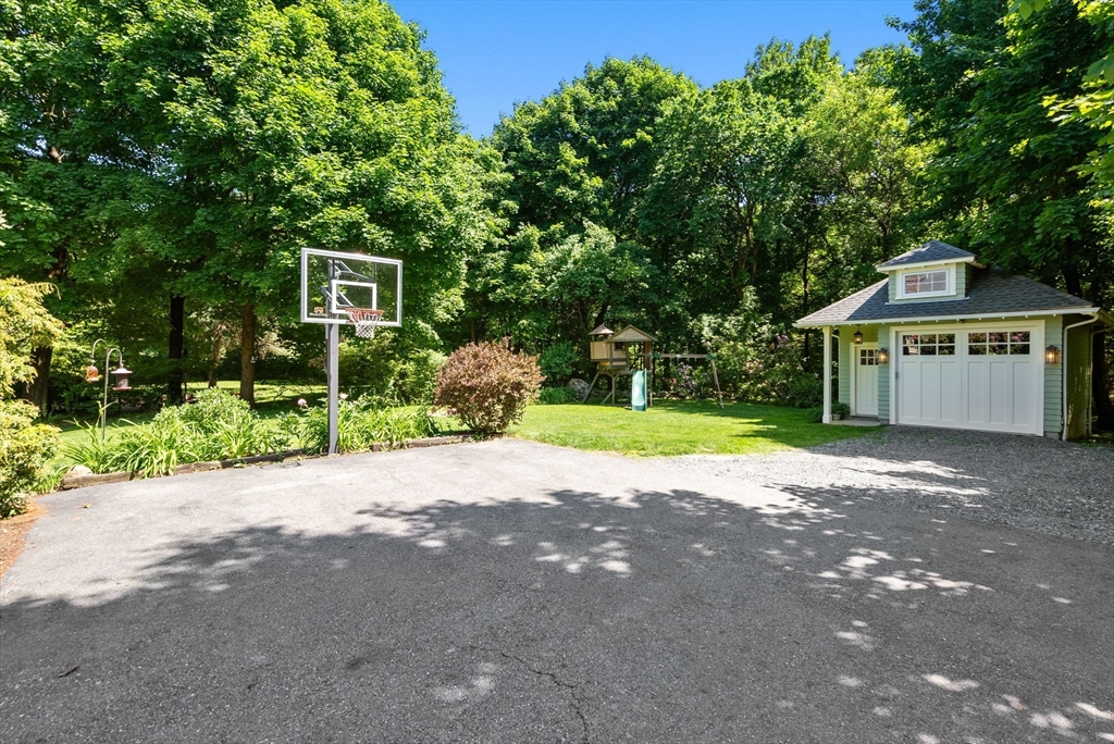 260 Glen Road Weston, MA 02493 - Photo 42 of 42 a front view of a house with a yard and a garage