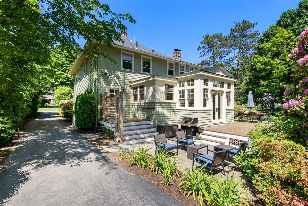 260 Glen Road Weston, MA 02493 - Photo 6 of 42 a front view of a house with a yard