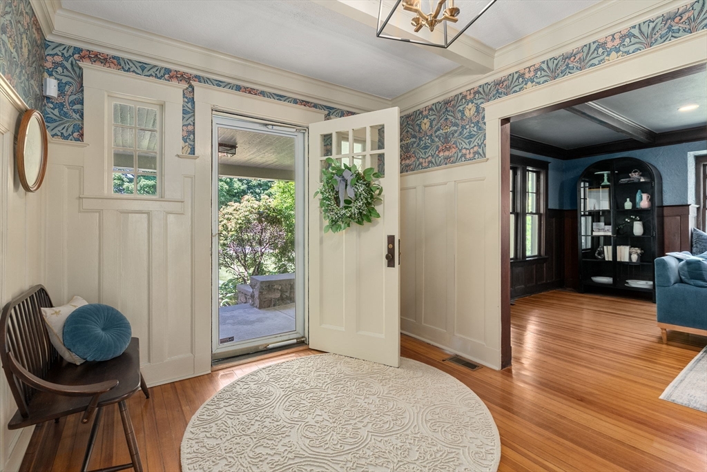 260 Glen Road Weston, MA 02493 - Photo 7 of 42 a view of a livingroom with furniture and hardwood floor