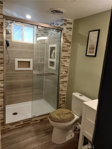 a bathroom with a sink vanity and mirror