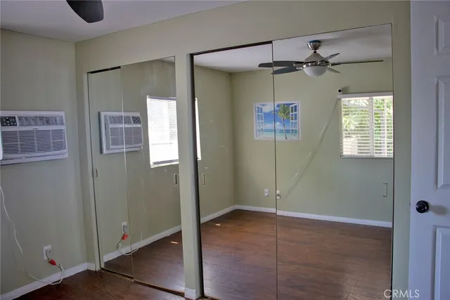 a view of an empty room with windows