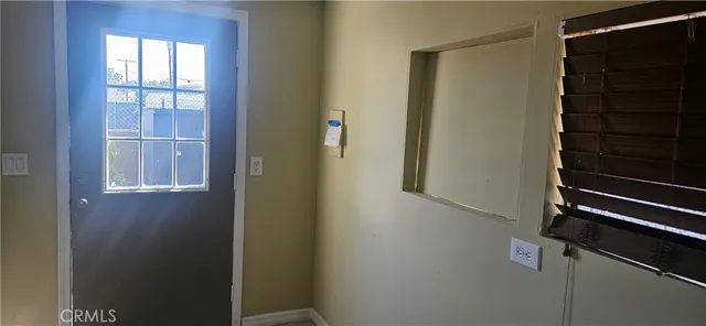 a view of a room that has a bench in it