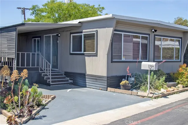 front view of a house with potted plants