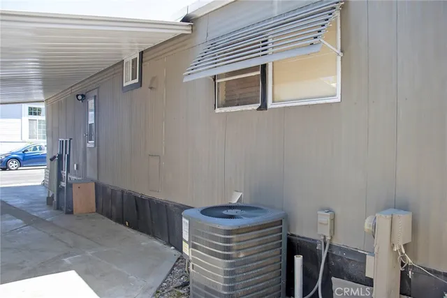 a balcony with outdoor seating and plants