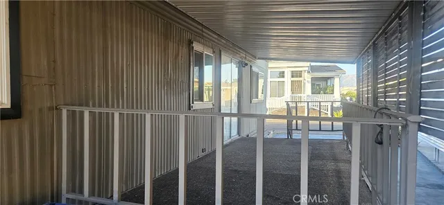 a wooden fence with trees in the background