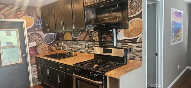 walk in closet with wooden floor