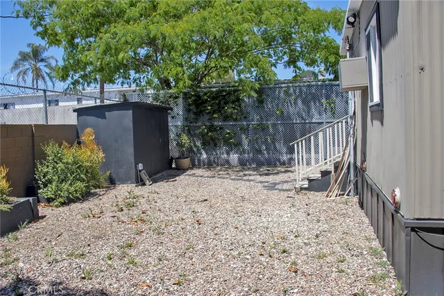 a view of a backyard of the house