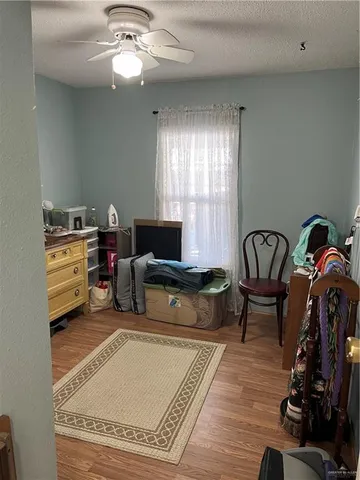 a living room with furniture a air conditioner and a window