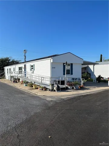 a view of a car park in front of house