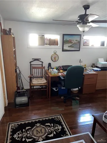 a kitchen with furniture and a stove