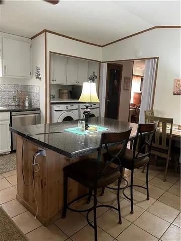 a kitchen with sink cabinets and window